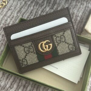 Authentic Gucci wallet. Never used. Given as a gift. Original box & packaging